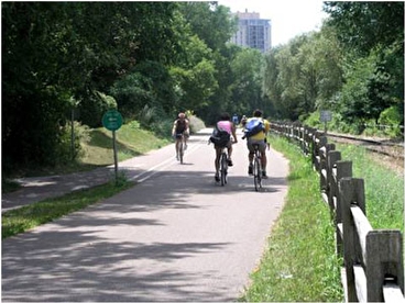 Bicyclists riding on a paved trail